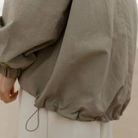 Manteau nylon ajustable